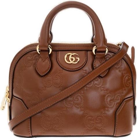 gucci gg logo plaque quilted shoulder bag|gucci monogram print.